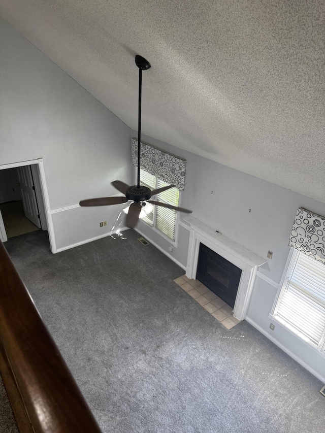 400 Natures Pointe Dr, Somerset, KY 42503 - unfurnished living room featuring carpet flooring, a fireplace with flush hearth, a textured ceiling, and ceiling fan