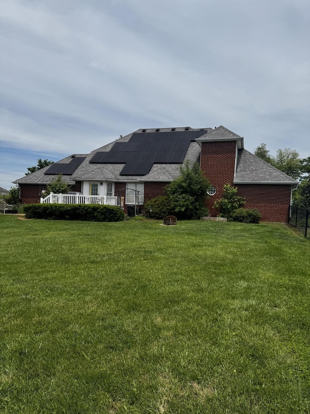 400 Natures Pointe Dr, Somerset, KY 42503 - back of property with solar panels, a lawn, and brick siding