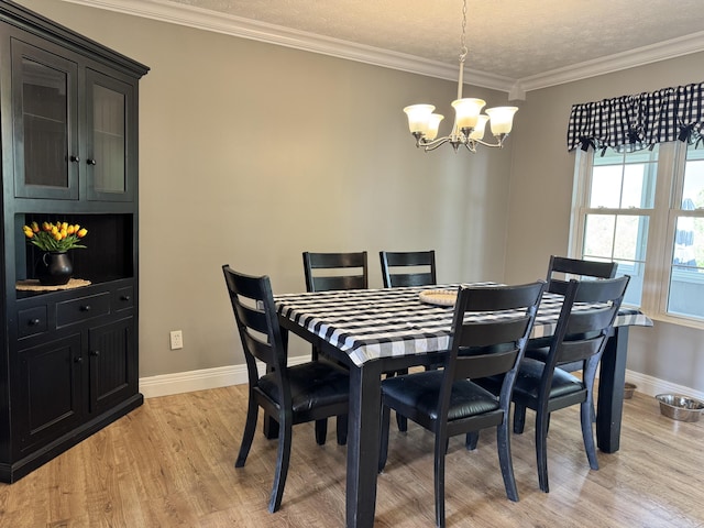 2230 Perryville Rd, Harrodsburg, KY 40330 - dining space with light wood-style flooring, a chandelier, baseboards, crown molding, and a textured ceiling