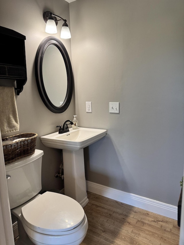 2230 Perryville Rd, Harrodsburg, KY 40330 - bathroom with wood finished floors, baseboards, and toilet