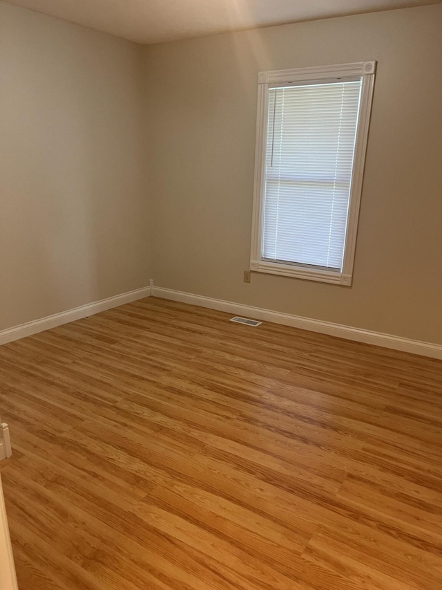 361 Puncheon Camp Rd, Russell Springs, KY 42642 - spare room featuring light wood-type flooring and baseboards
