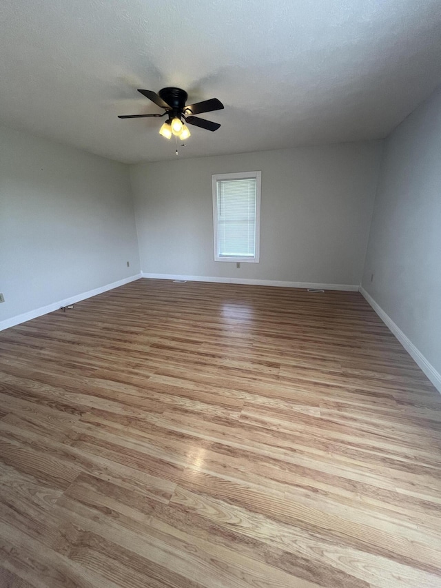 361 Puncheon Camp Rd, Russell Springs, KY 42642 - empty room with baseboards, light wood finished floors, and a ceiling fan
