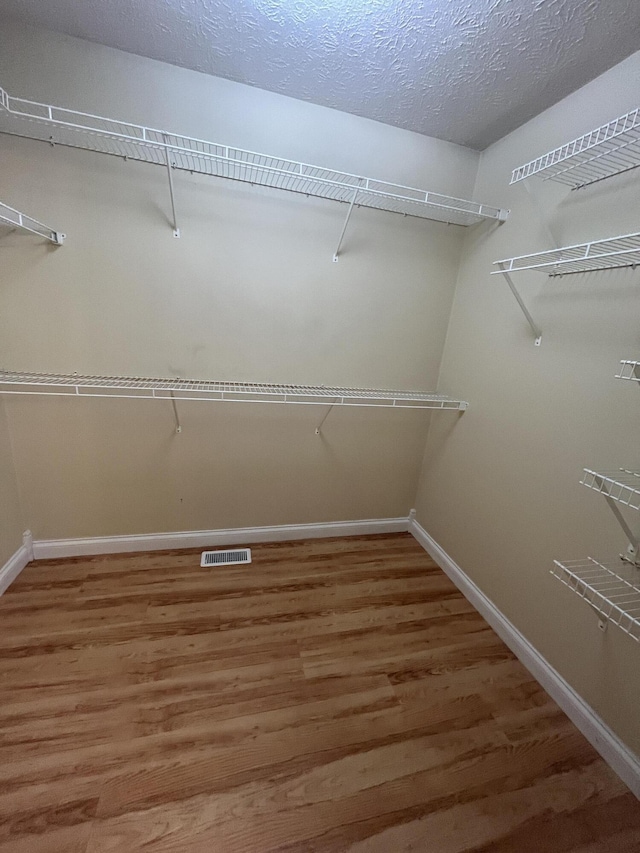 361 Puncheon Camp Rd, Russell Springs, KY 42642 - spacious closet featuring wood finished floors