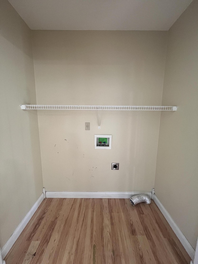 361 Puncheon Camp Rd, Russell Springs, KY 42642 - laundry room featuring electric dryer hookup, wood finished floors, hookup for a washing machine, and baseboards