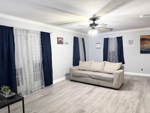 27 Bait Shop Rd, Salt Lick, KY 40371 - living room featuring wood finished floors, baseboards, a ceiling fan, and ornamental molding
