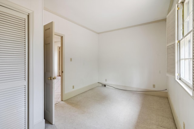 unfurnished bedroom featuring ornamental molding