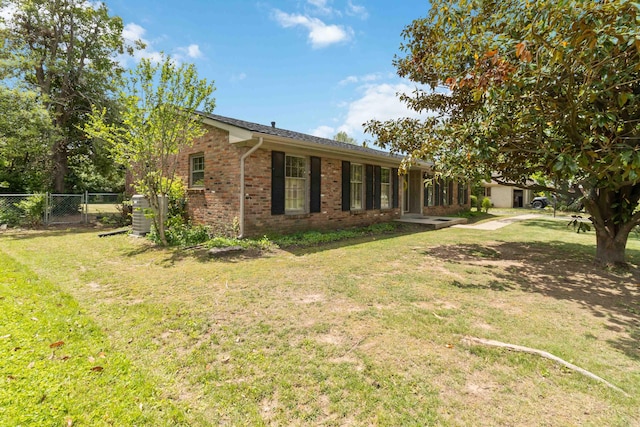 view of side of property featuring brick siding