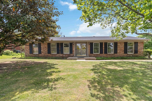 ranch-style home with brick siding and a front lawn