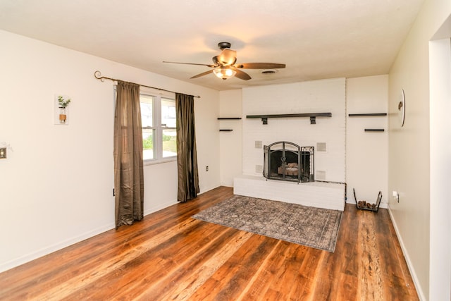1102 Iroquois Dr, Mt Sterling, KY 40353 - living room with a ceiling fan, wood finished floors, a fireplace, and baseboards