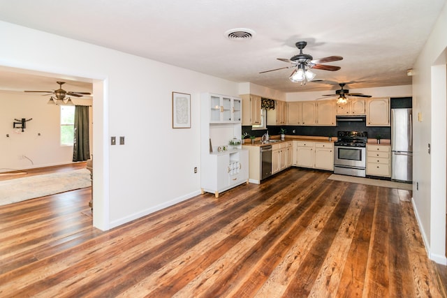 1102 Iroquois Dr, Mt Sterling, KY 40353 - kitchen featuring appliances with stainless steel finishes, ceiling fan, dark wood-type flooring, under cabinet range hood, and baseboards
