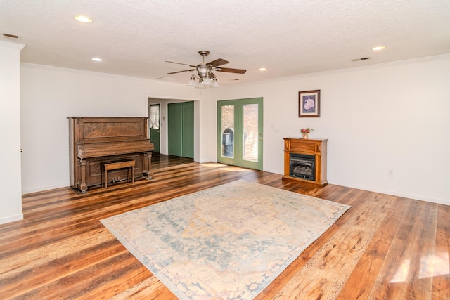 1102 Iroquois Dr, Mt Sterling, KY 40353 - living area with a ceiling fan, ornamental molding, a fireplace, wood finished floors, and recessed lighting