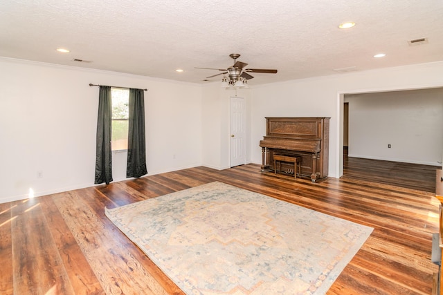 1102 Iroquois Dr, Mt Sterling, KY 40353 - living area featuring ceiling fan, ornamental molding, wood finished floors, a textured ceiling, and recessed lighting