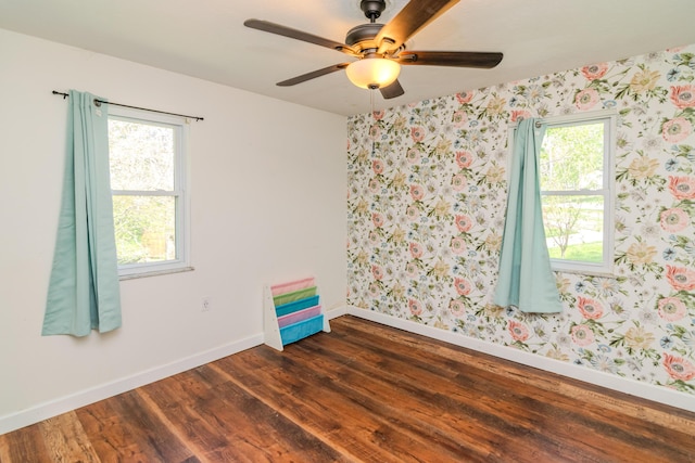 1102 Iroquois Dr, Mt Sterling, KY 40353 - unfurnished room featuring plenty of natural light, baseboards, dark wood-style floors, and wallpapered walls