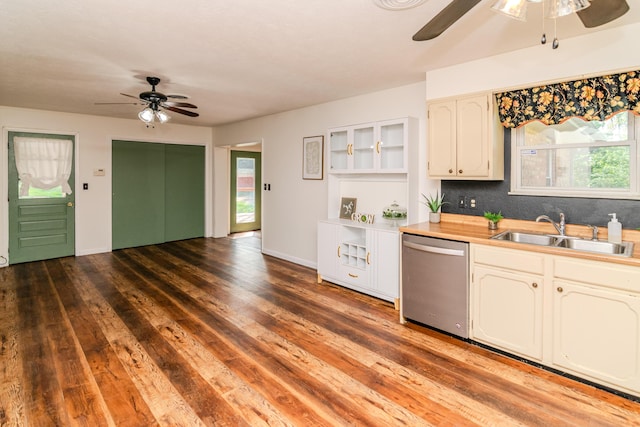1102 Iroquois Dr, Mt Sterling, KY 40353 - kitchen with stainless steel dishwasher, a ceiling fan, a sink, wood finished floors, and healthy amount of natural light