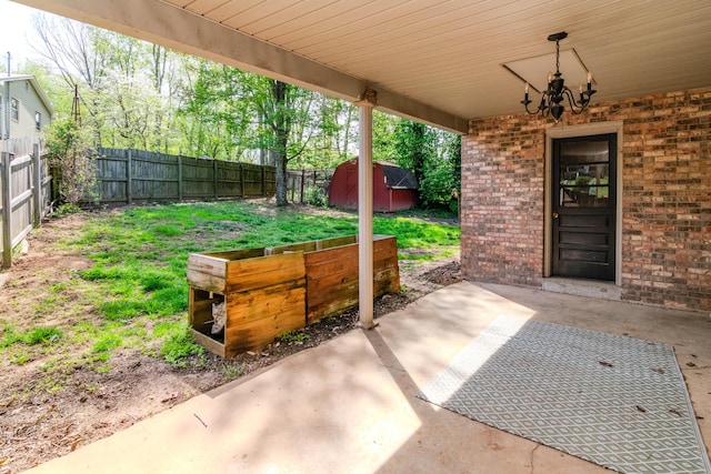 1102 Iroquois Dr, Mt Sterling, KY 40353 - view of patio featuring a fenced backyard, a shed, and an outbuilding