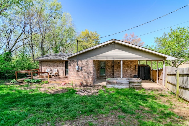 1102 Iroquois Dr, Mt Sterling, KY 40353 - back of property featuring brick siding, a deck, and a patio area
