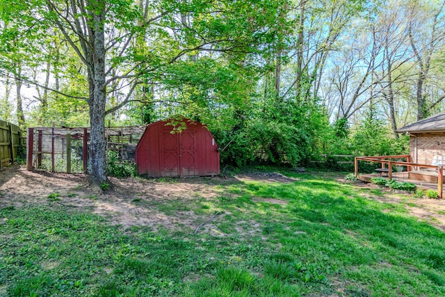 1102 Iroquois Dr, Mt Sterling, KY 40353 - view of yard featuring an outbuilding, a storage shed, and a wooden deck