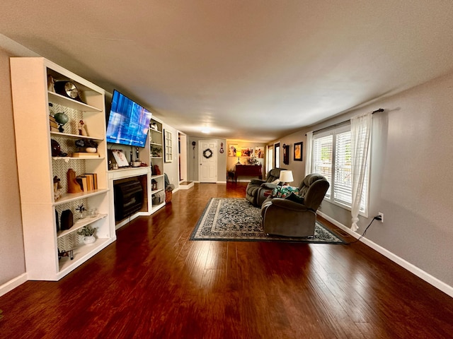 199 Langnau Rd, London, KY 40741 - living room featuring wood finished floors, baseboards, and built in shelves
