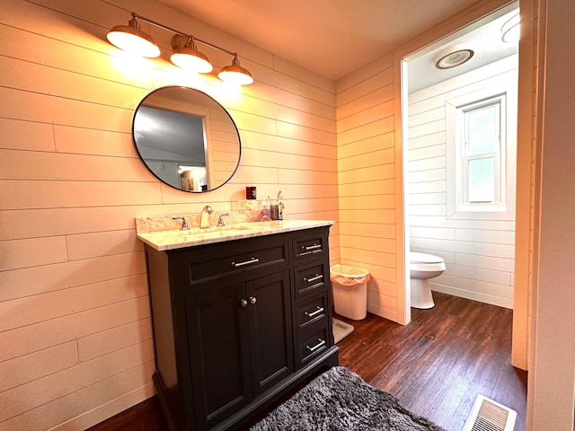 199 Langnau Rd, London, KY 40741 - bathroom with wooden walls, wood finished floors, vanity, and toilet