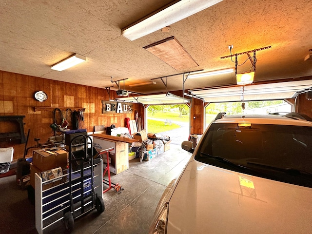 199 Langnau Rd, London, KY 40741 - garage with wood walls and a garage door opener