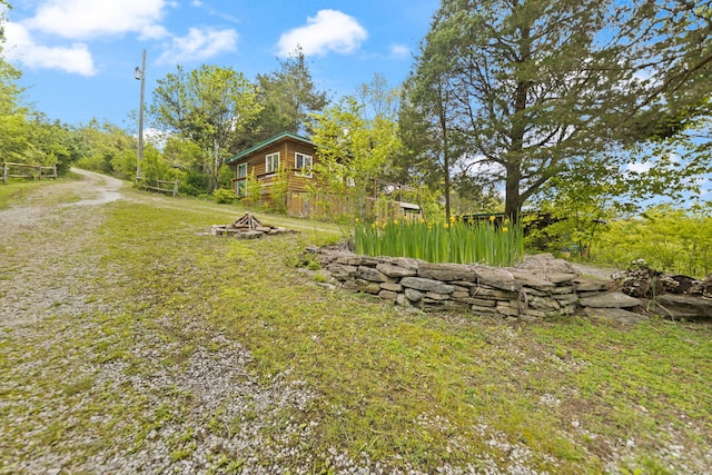 571 Whitlock Rd, Richmond, KY 40475 - view of grassy yard featuring an outdoor fire pit and a deck