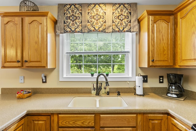 kitchen with a sink and light countertops