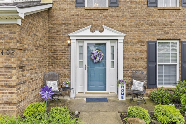 entrance to property with brick siding
