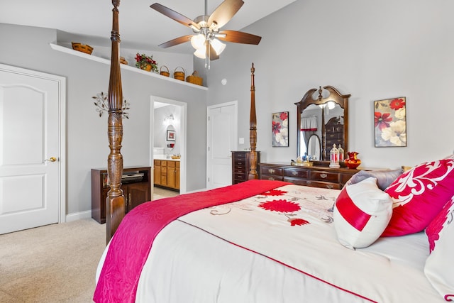 bedroom with high vaulted ceiling, light colored carpet, ensuite bathroom, a ceiling fan, and baseboards
