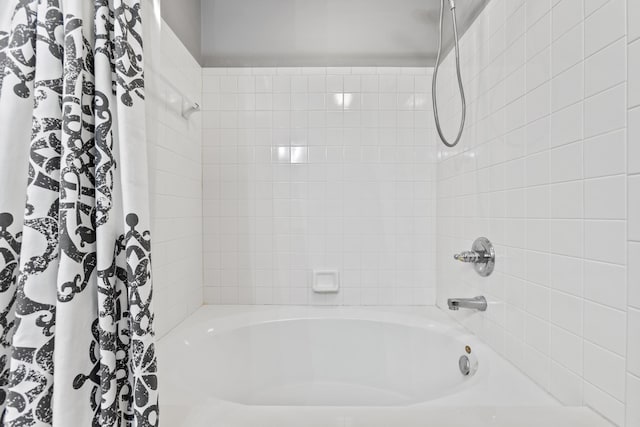 full bathroom featuring shower / tub combo with curtain
