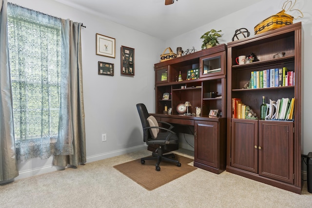 office featuring carpet, ceiling fan, and baseboards