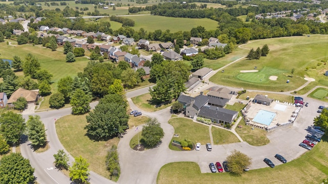 view of property location with nearby suburban area and a golf course