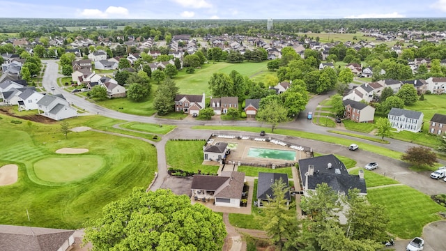 aerial overview of property's location featuring nearby suburban area and a golf course