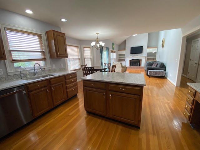4120 Amberwood Ct, Lexington, KY 40513 - kitchen with dishwasher, a sink, light wood-type flooring, a chandelier, and recessed lighting
