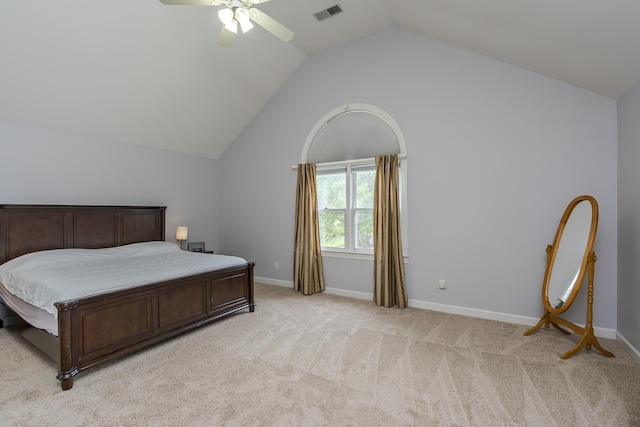 bedroom with lofted ceiling, light carpet, a ceiling fan, and baseboards