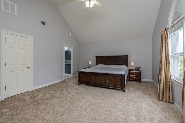 bedroom with multiple windows, light carpet, high vaulted ceiling, and baseboards