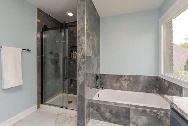 full bathroom with marble finish flooring, a stall shower, a garden tub, vanity, and baseboards