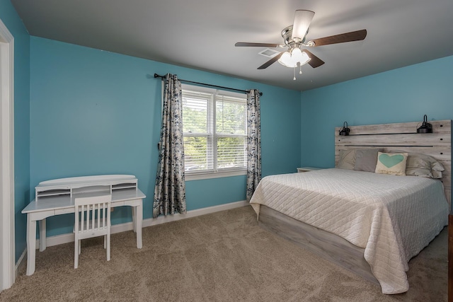 bedroom with baseboards, carpet flooring, and a ceiling fan