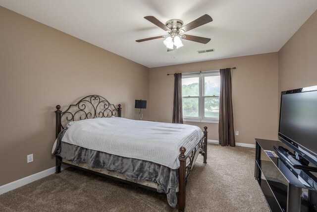 bedroom featuring carpet flooring, baseboards, and a ceiling fan