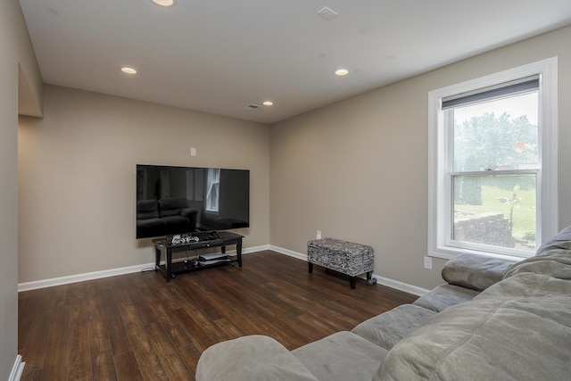 living area featuring wood finished floors, baseboards, and recessed lighting