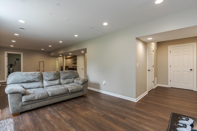 living room featuring dark wood-style floors, recessed lighting, and baseboards