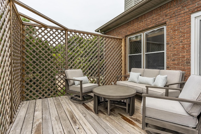 wooden deck with outdoor lounge area