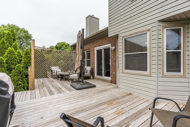 wooden terrace with area for grilling