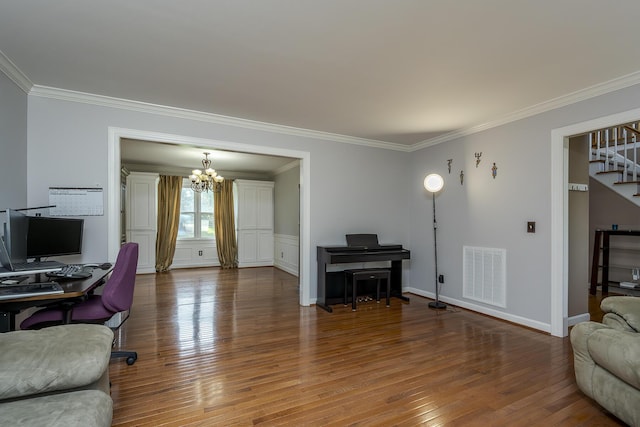 living area with a chandelier, crown molding, stairway, wood finished floors, and an office area