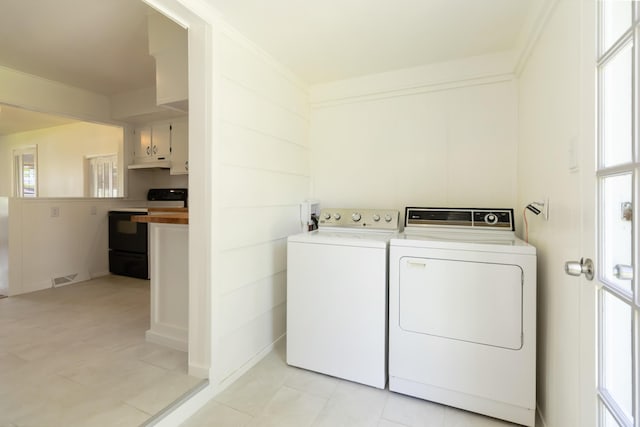 6362 E Laurel Rd, London, KY 40741 - laundry area with separate washer and dryer and light tile patterned flooring