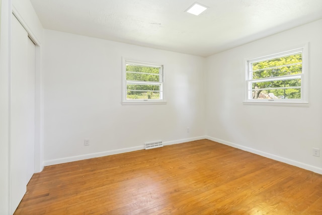 6362 E Laurel Rd, London, KY 40741 - unfurnished room featuring light wood-type flooring, plenty of natural light, and baseboards