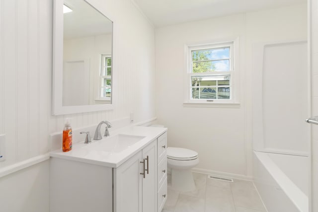6362 E Laurel Rd, London, KY 40741 - bathroom featuring vanity, toilet, tile patterned flooring, a tub to relax in, and baseboards