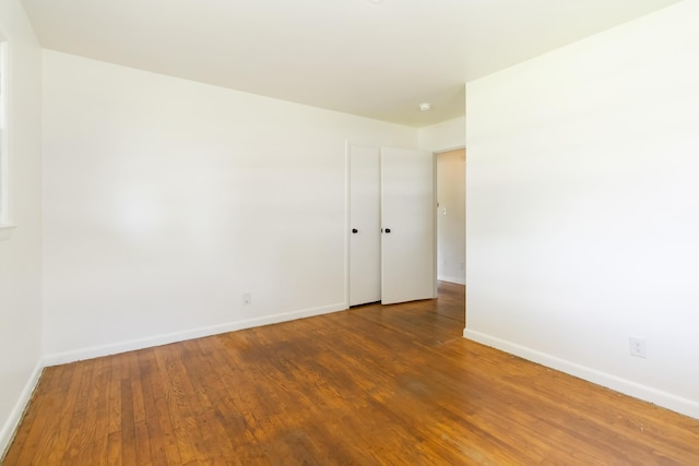 6362 E Laurel Rd, London, KY 40741 - unfurnished room with baseboards and wood finished floors