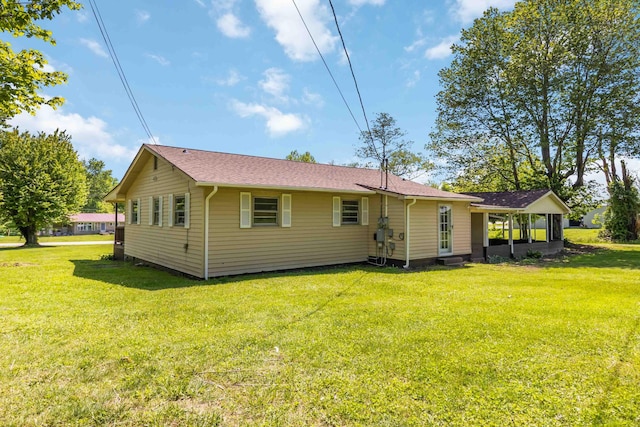 6362 E Laurel Rd, London, KY 40741 - back of house featuring a yard and a shingled roof