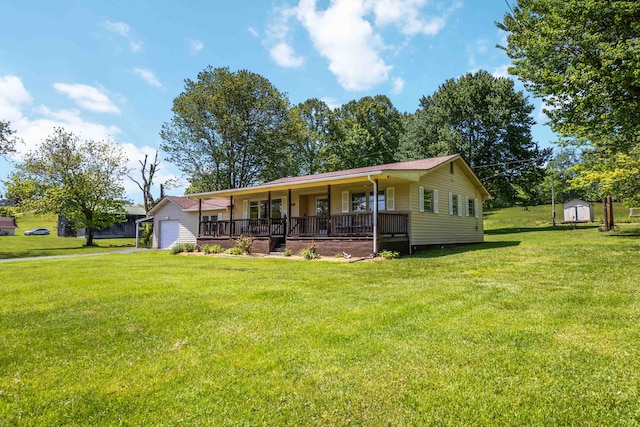 6362 E Laurel Rd, London, KY 40741 - single story home with a porch, an outdoor structure, a front lawn, and a storage unit