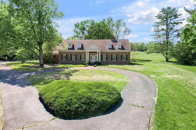 1373 Delong Cir, Lexington, KY 40515 - greek revival house with a front lawn, brick siding, and curved driveway